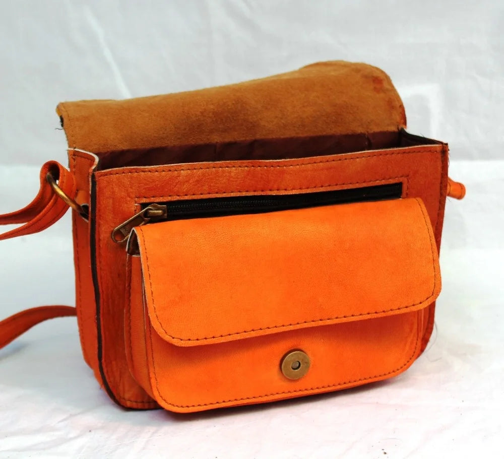 Vintage ethnic leather crossbody bag featuring orange suede material and adjustable shoulder strap.