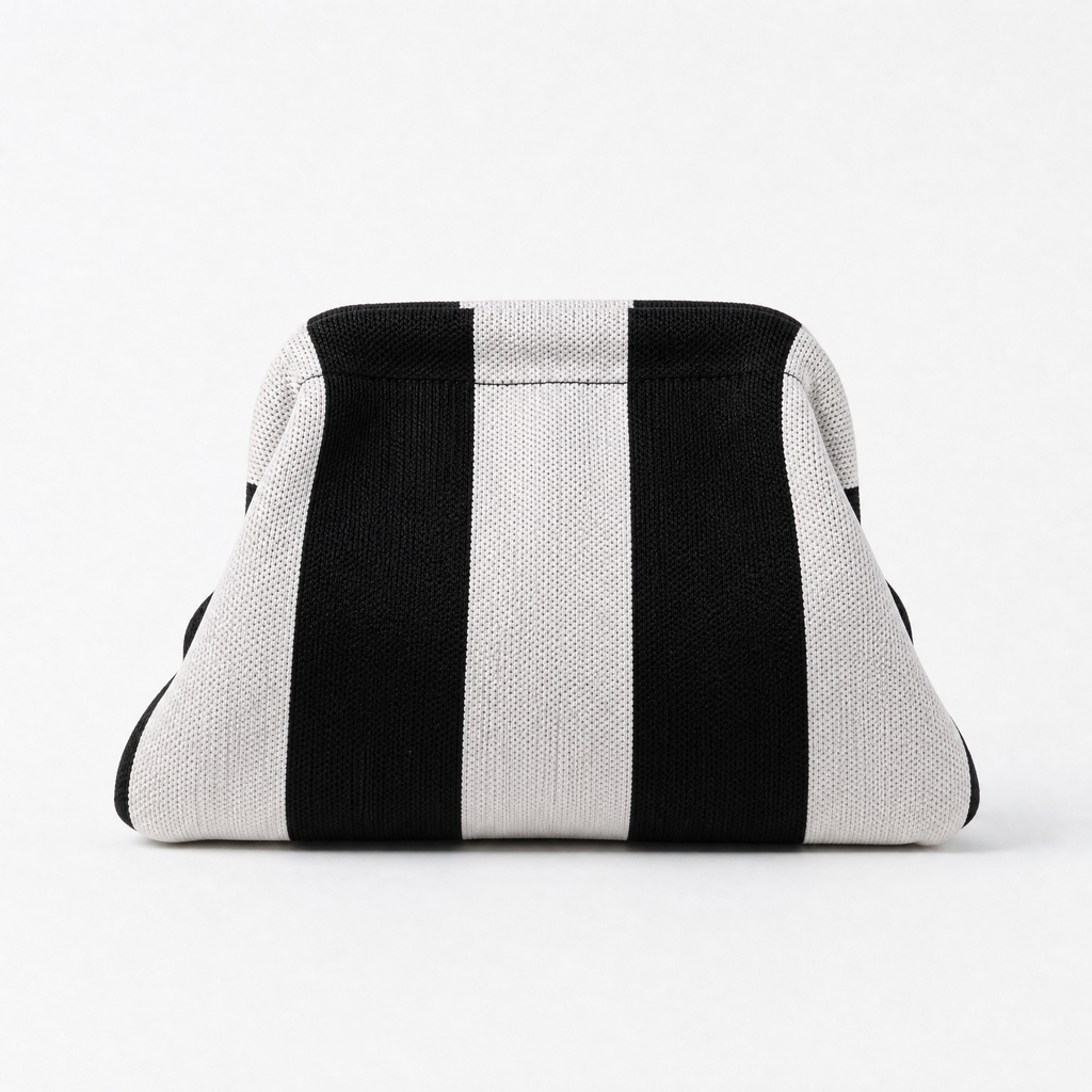 Black and white striped machine washable everywhere clutch bag, perfect for versatile styling and ease of maintenance.