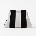 Black and white striped machine washable everywhere clutch bag, perfect for versatile styling and ease of maintenance.