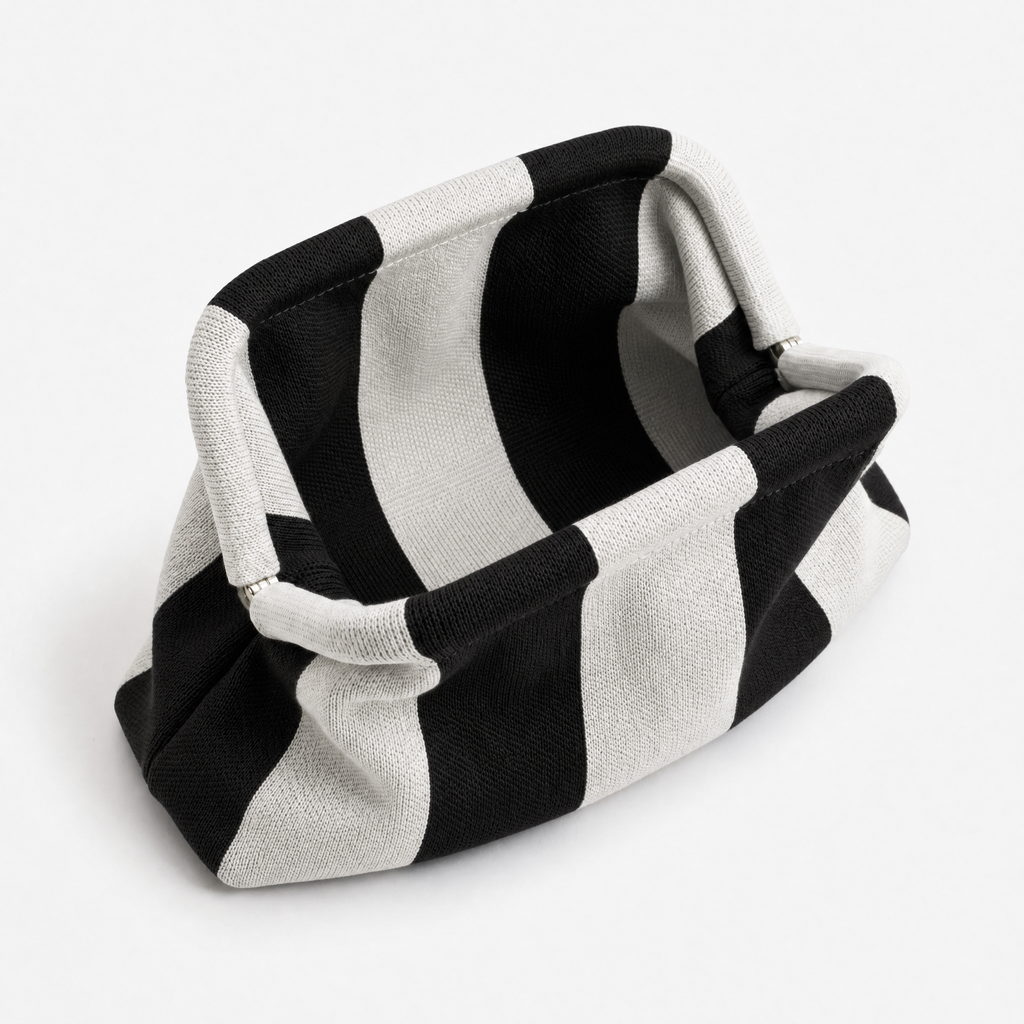 machine washable everywhere clutch in black and white striped design, versatile for various occasions
