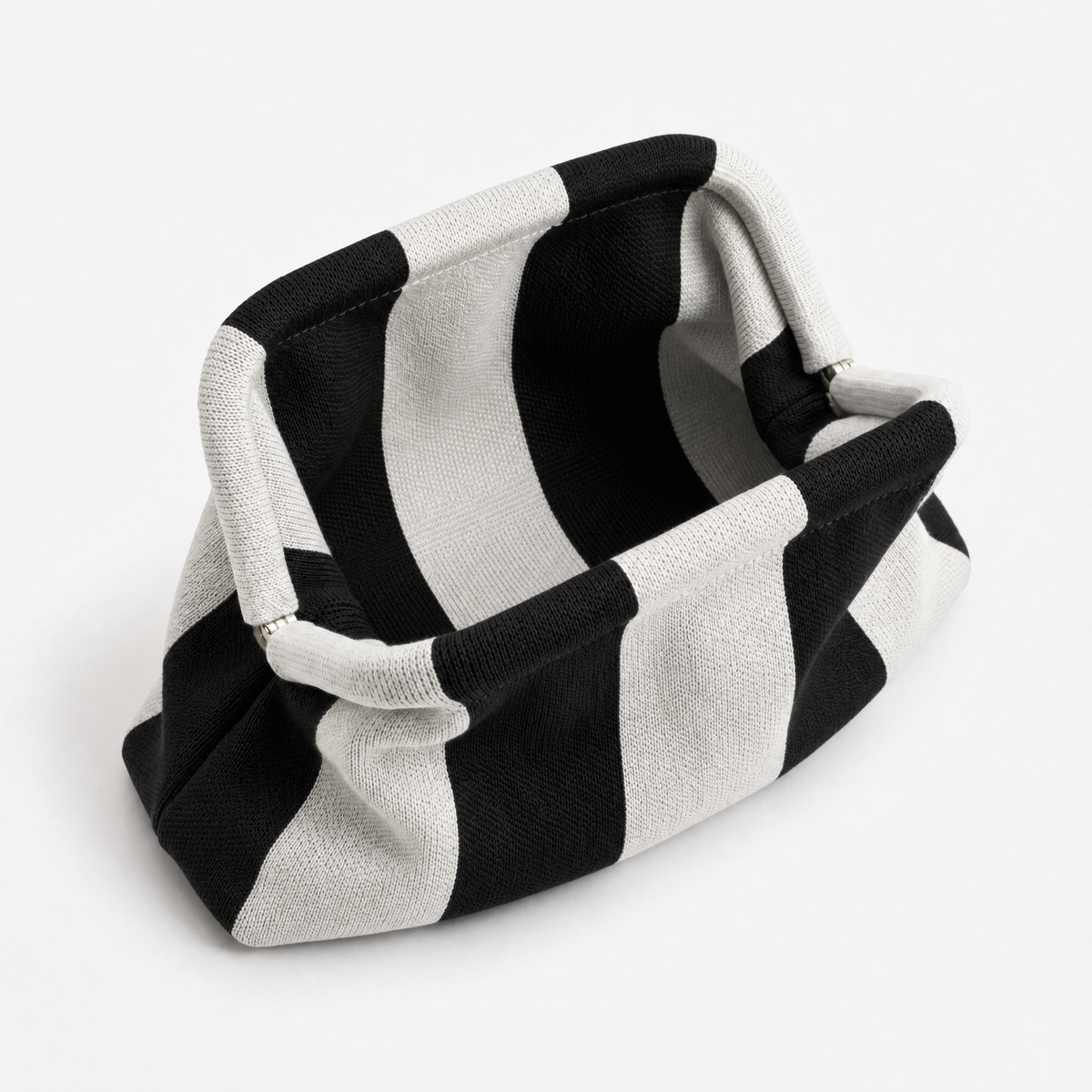 machine washable everywhere clutch in black and white striped design, versatile for various occasions